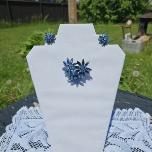Triple Blue toned flower Japanned back Sherman brooch and earrings.